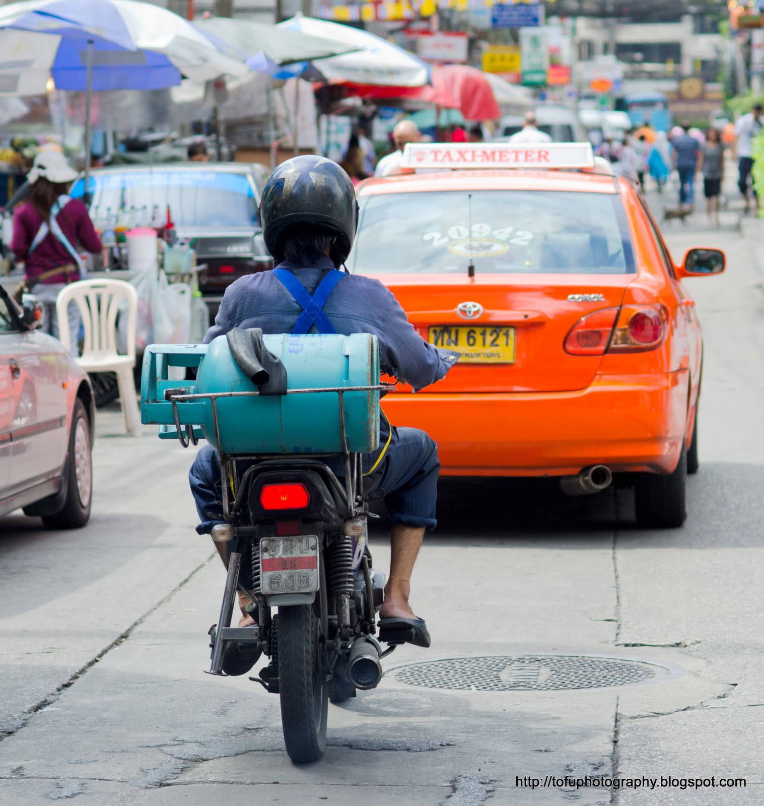 Tofu Photography Carrying a gas cyclinder on a motorbike!
