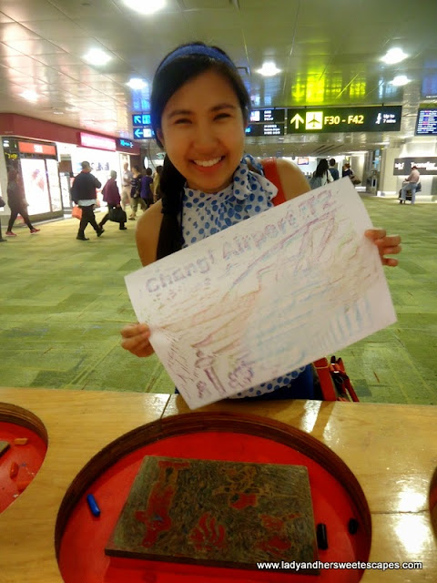 Lady's finished art in Changi Airport Singapore