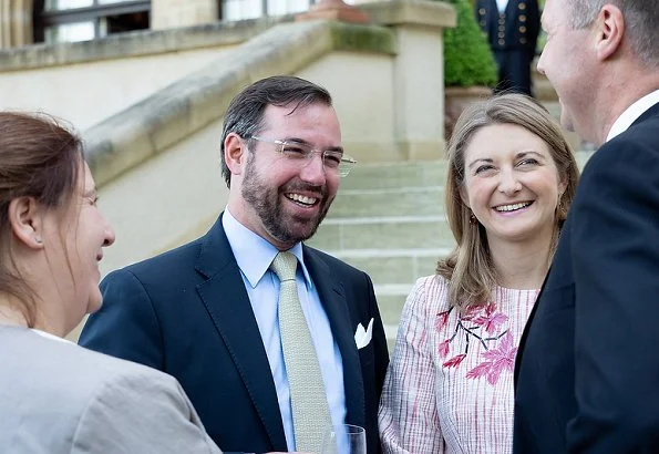 Duke Henri, Maria Teresa, Prince Guillaume and Princess Stephanie at a reception. Maria Teresa wore blue dress, Stephanie wore Prada floral dress