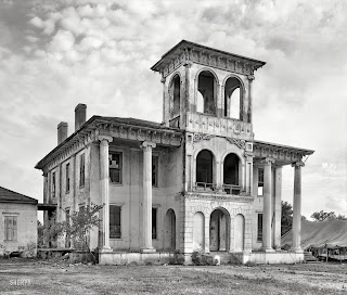 A large black and white image of The Drish House structure