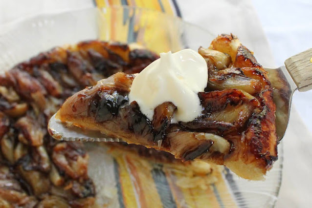 Food Lust People Love: This Caramelized Shallot and Anchovy Puff Pastry Tart is savory tarte tatin made with caramelized shallots, anchovies and wine and puff pastry. It is an elegant main course or appetizer.