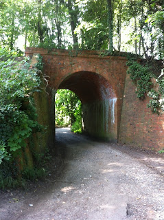 Brick bridge carrying the former Lambourn Valley railway line over Moor Lane, Newbury
