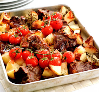Rosemary Roast Chops and potatoes. Classic one-pot roast dish of lamb chops, potatoes and tomatoes with rosemary.
