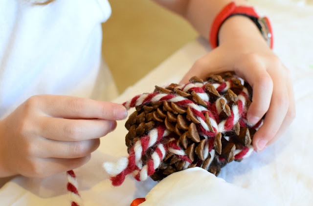 Yarn Wrapped Pinecone Ornaments- beautiful nature ornament craft for Christmas. Kids can work on fine motor work while they work on this fun activity, great for preschoolers, kindergartners, or elementary students.