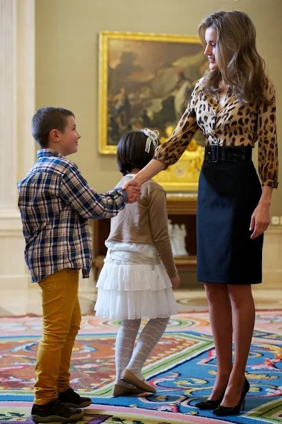 Princess Letizia wore Hugo Boss leopard blouse and Boss black skirt. Style of Princess Letizia