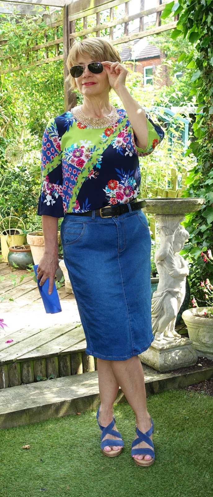 A denim skirt goes with so many looks, in this case a brightly coloured patterned top