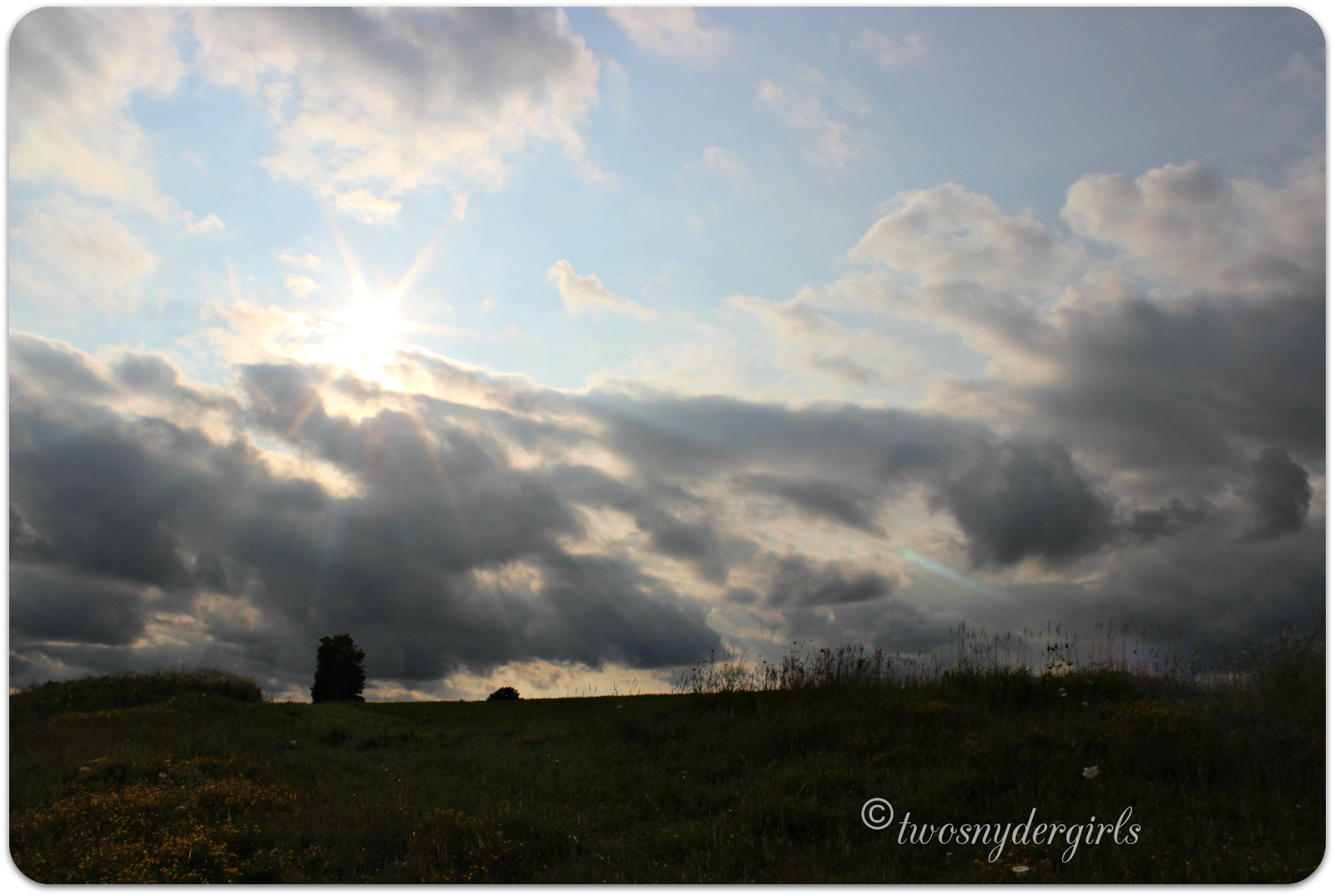 Sun coming out behind storm clouds