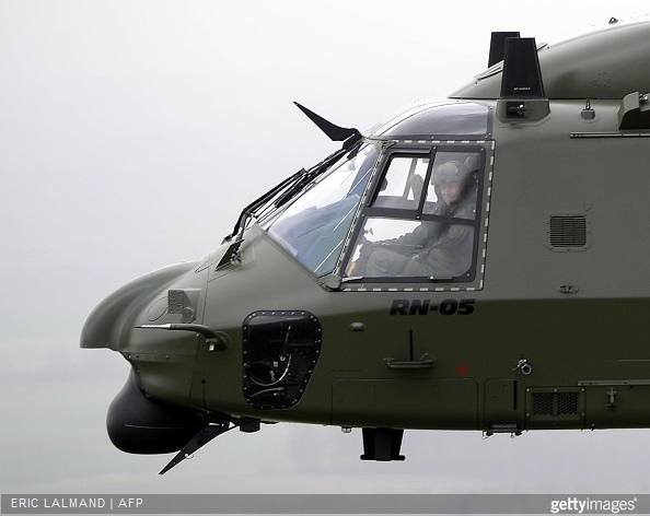Belgium's King Philippe is pictured at the command of a NH90 helicopter during a visit to the Beauvechain Air Base