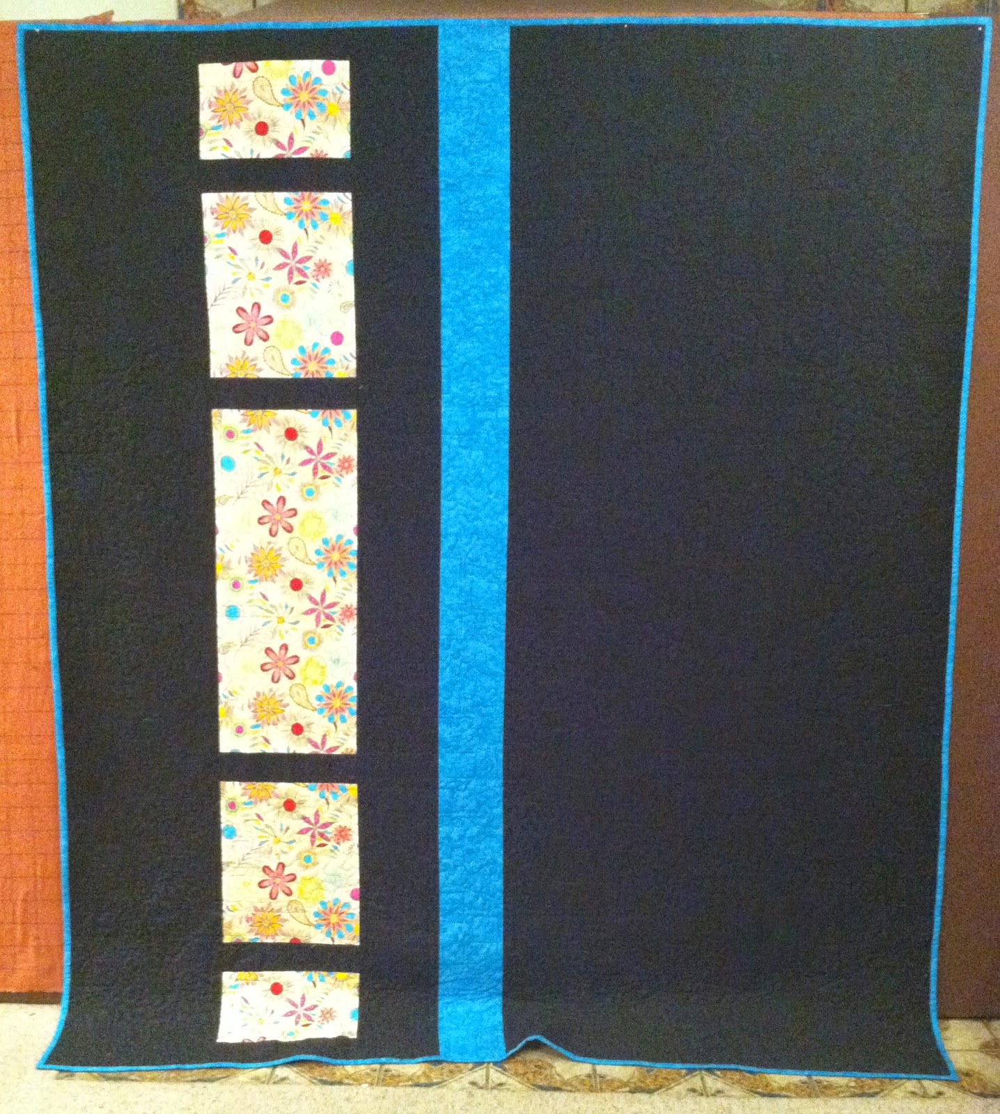 Jelly Roll Quilt - Bright colors against a black background is stunning! Reversible too!