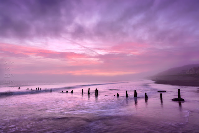 Photograph of beach groynes at sunrise in Sandsend seafront by Martyn Ferry Photography