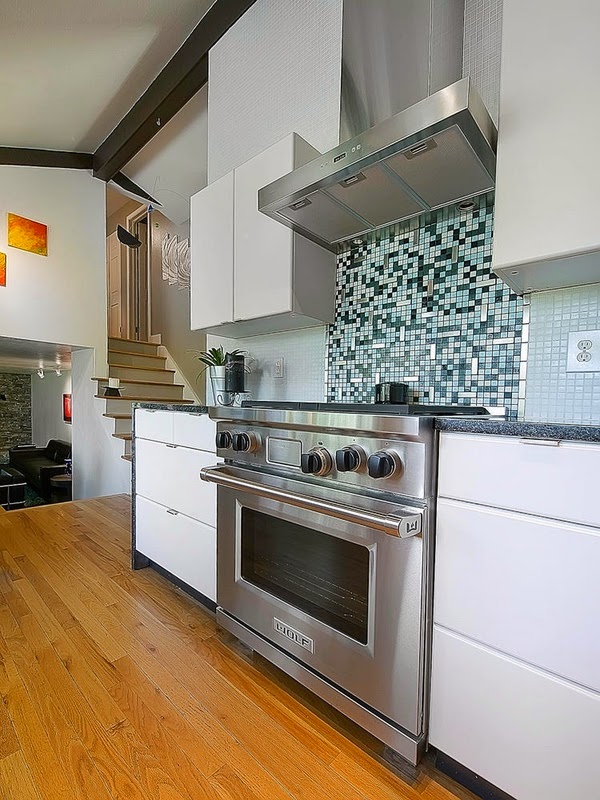 White kitchen with a touch of color