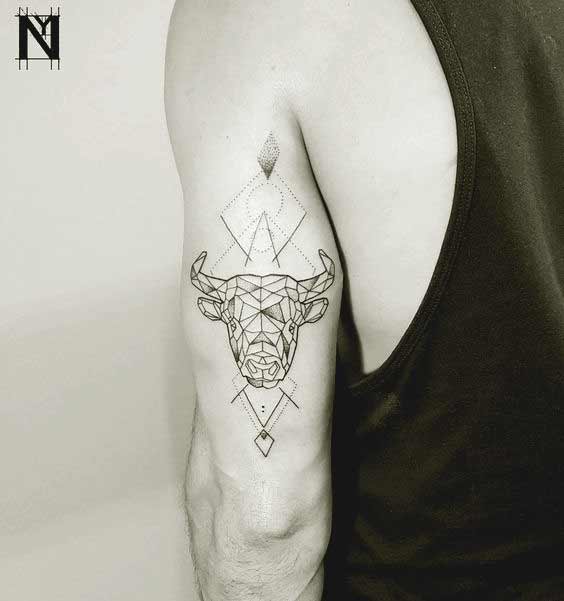Geometric Taurus bull and constellation tattoo design on arm