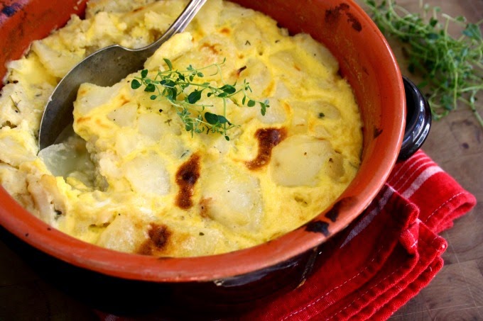 Salt Cod Potato Gratin is rich and satisfying with potatoes, a little cream and seasoned with bay leaves and thyme. 