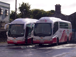 two Bus Eireann coaches parked at Galway Travel Centre, beside St Patricks band-hall