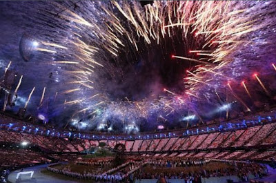 Fireworks explode over the Olympic Stadium during Opening Ceremony