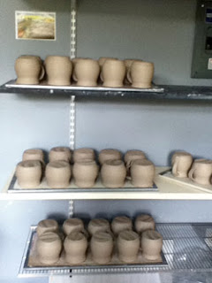 Drying ceramic pieces by Lori Buff