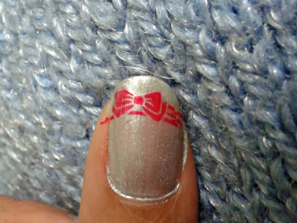 red stamped bow nail art