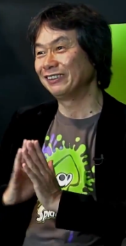 Shigeru Miyamoto making an Illuminati symbol