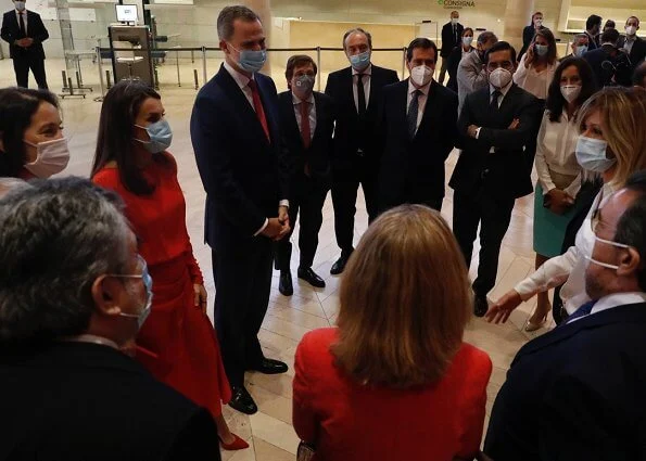 Queen Letizia wore Massimo Dutti limited edition draped silk dress. Magrit red pumps, carries Carolina Herrera clutch. Coolook Nereida earrings