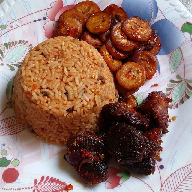 Delicious Jollof Rice And Beans With Fried Plantain And Meat