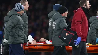 Hector Bellerin being carried on a stretcher after sustaining and injury against Chelsea