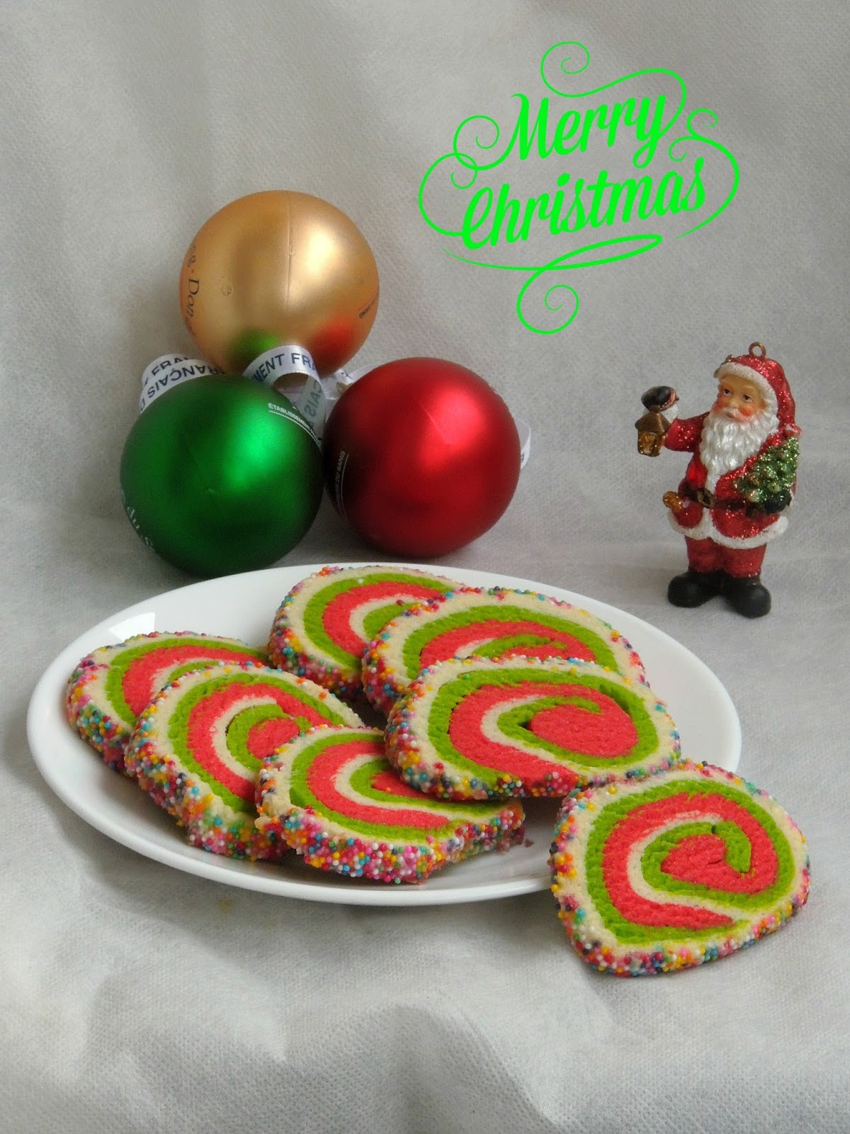 Priya's Versatile Recipes Sprinkles Crusted Eggless Christmas Pinwheel