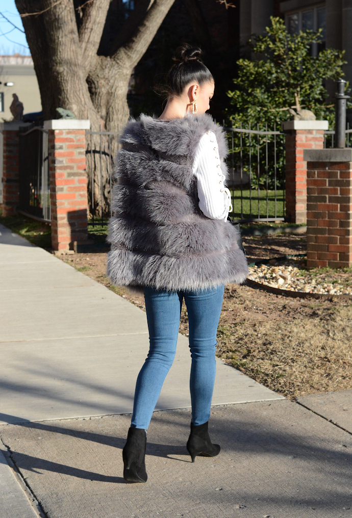grey faux fur vest, statement earrings, kitten heels