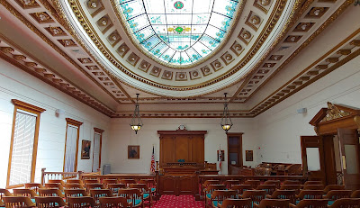 Empty courtroom looking toward the judge's podium