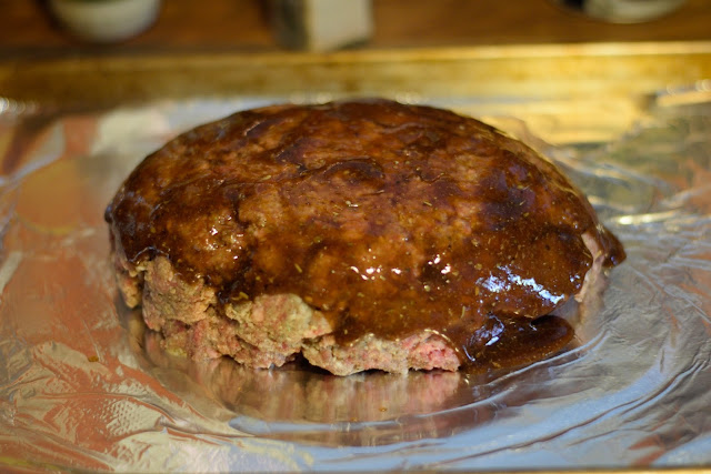 Half of the glaze poured over the meatloaf.