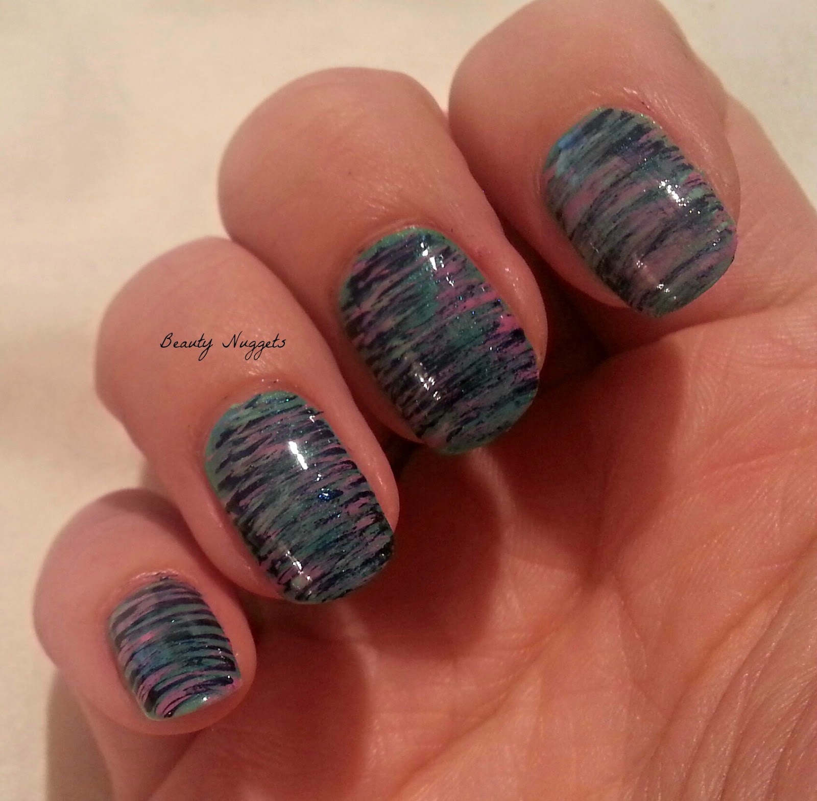 Beauty Nuggets Nail art using a fan brush