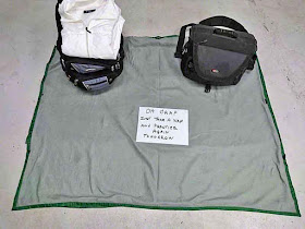 camera bag, backpack sign