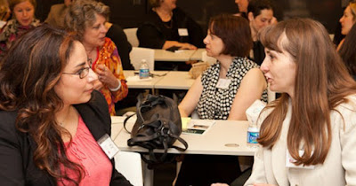 Women entrepreneurs at a group meeting for an association