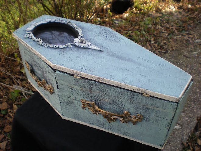 Coffin display case with creepy green glow lights