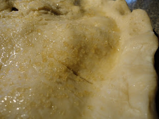 pie crust brushed with egg wash and turbinado sugar