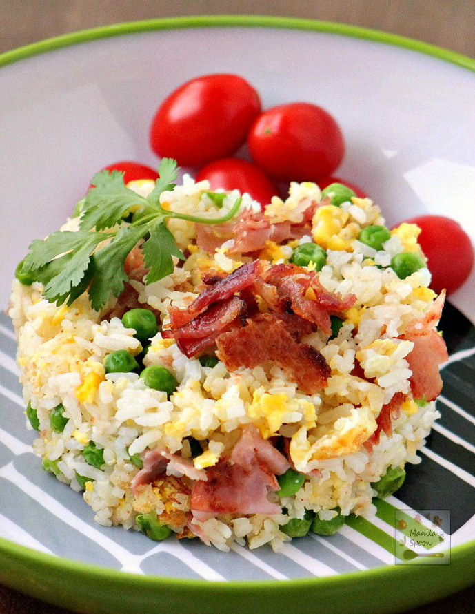 Left-over rice? No problem! Turn it into delicious fried rice flavored with bacon, garlic and eggs! Easy and delicious instant side dish! | manilaspoon.com