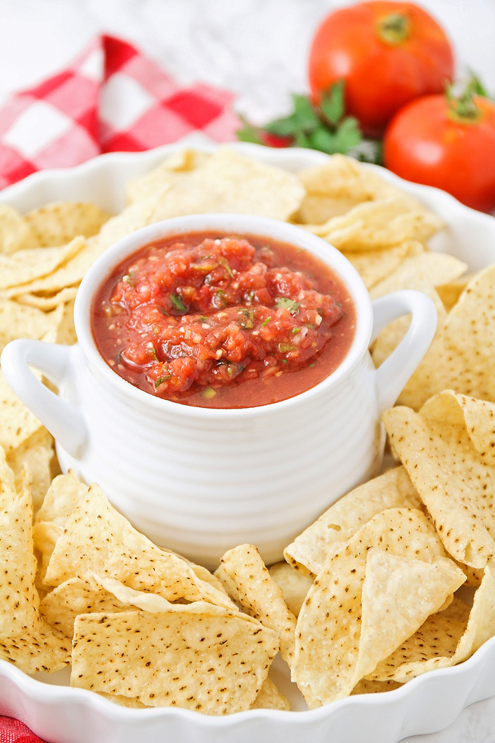 This delicious and flavorful salsa is made with fresh tomatoes and peppers. It's the perfect way to use up those garden tomatoes!
