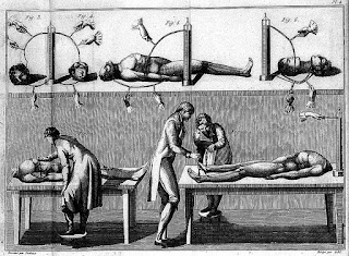 Aldini conducing experiments in galvanism, as  depicted in a 19th century book