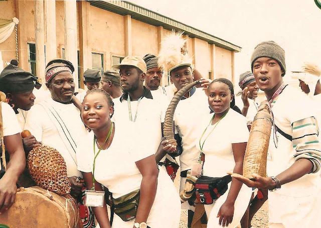 Plateau state natives in costume after a music performance posing with corp members Plateau state natives in costume after a music performance posing with corp members