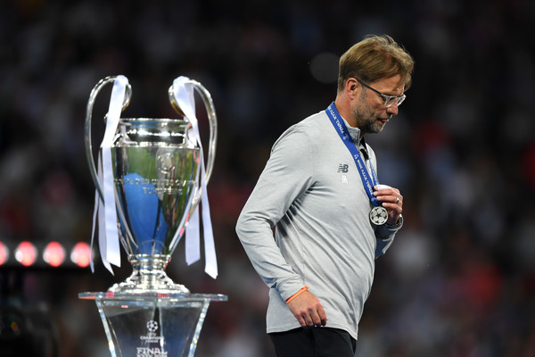 Jurgen Klopp, Manager of Liverpool walks past the UEFA Champions League trophy following the UEFA Champions League Final between Real Madrid and Liverpool at NSC Olimpiyskiy Stadium on May 26, 2018 in Kiev, Ukraine.