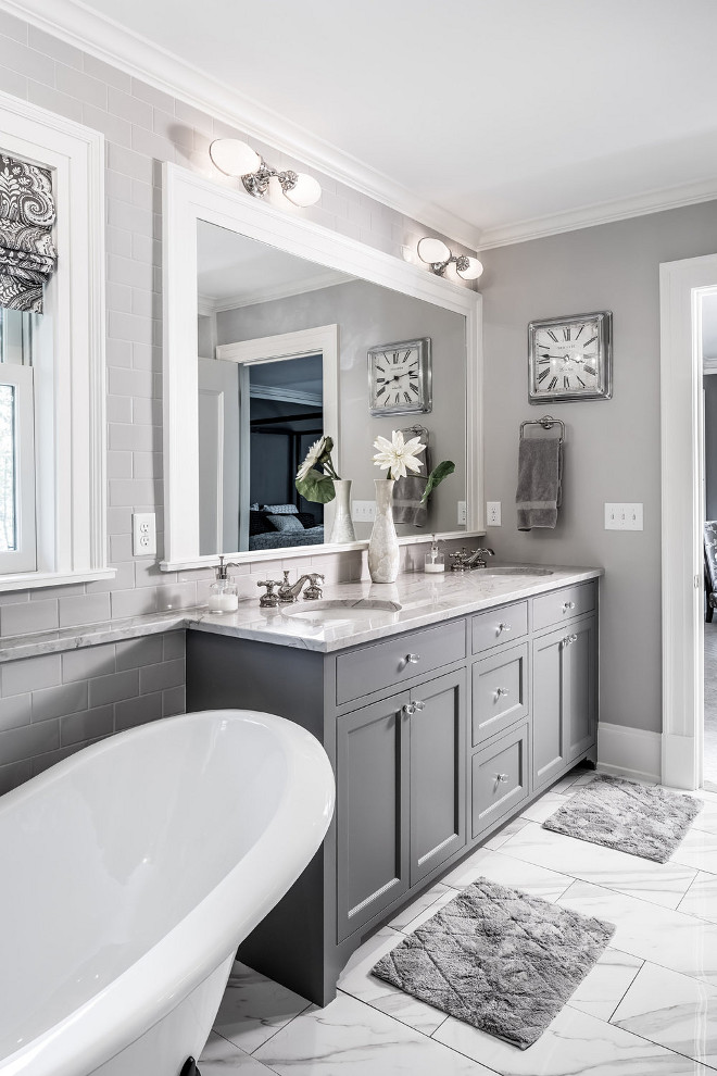 What Colors Go Well In A Gray Bathroom? 11+ Gray Bathroom Ideas To Inspire You! 1 Gray and white bathroom design - Dark grey bathroom cabinets with grey walls and white accents.