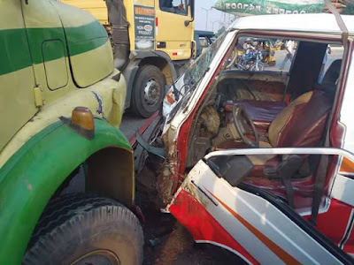 Photos: Passengers escape death as bus rams into truck in Anambra