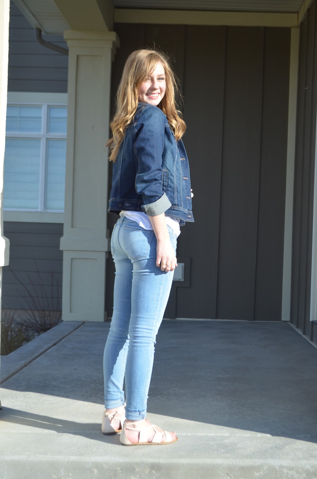dark blue shirt and light blue jeans