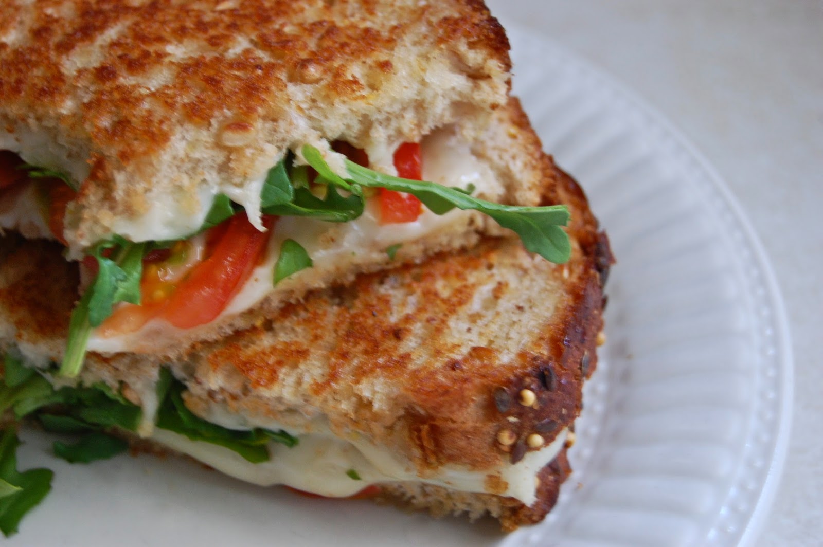 Poppi Linn Grilled CheeseJarlsberg, Mozzarella, Arugula, Tomato