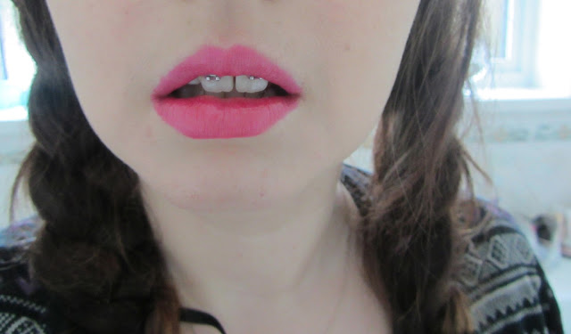 Roxy, a girl with braces models Revlon Just Bitten Lip Stain in Pink colour called lovesick