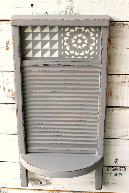 Photo of a painted, stenciled washboard with shelf