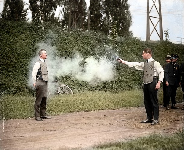 W.H. Murphy and his associate demonstrating their bulletproof vest on October 13, 1923
