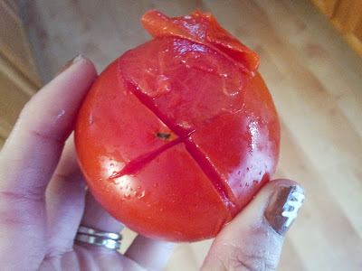 Once you've blanched the tomato, the peel starts to come off by itself