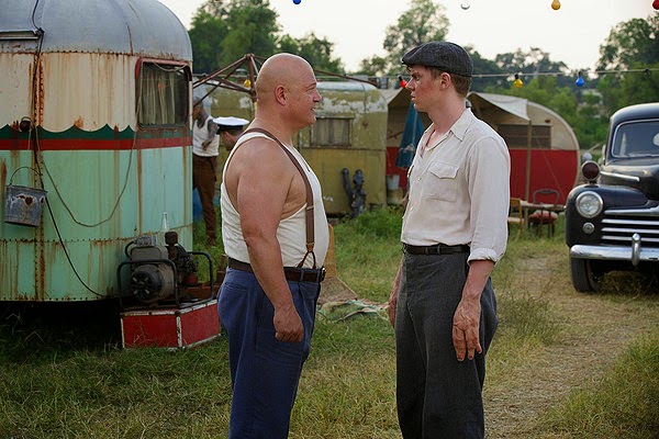 Michael Chiklis and Evan Peters as strongman Dell Toledo and Jimmy Darling in American Horror Story Season 4 Episode 2 Massacres and Matinees