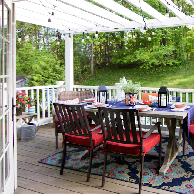 Outdoor farmhouse table under DIY Pergola