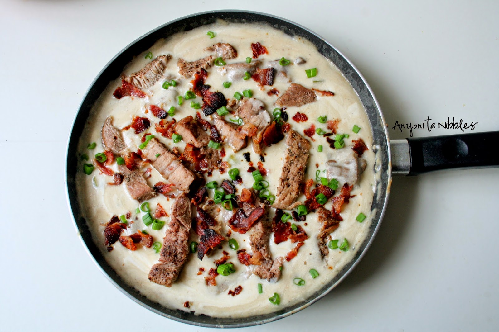 This gluten free, creamy pork shop skillet soup is light and indulgent.